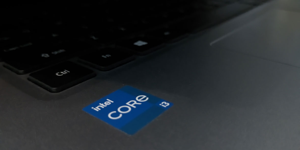 Intel Core i3 processor badge sticker on a laptop.