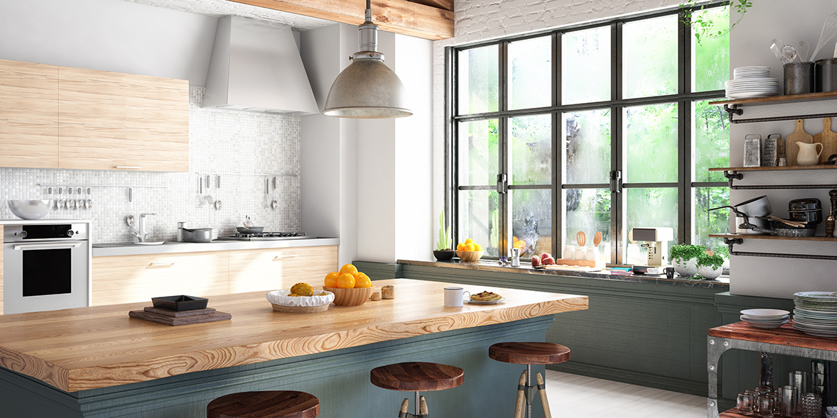 Green kitchen with an island